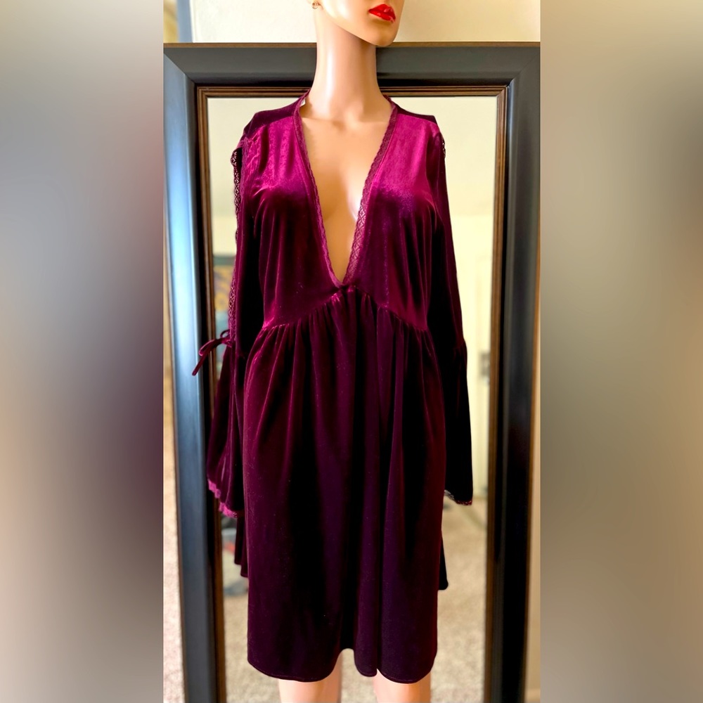 Maroon velvet dress with low v-lined cleavage